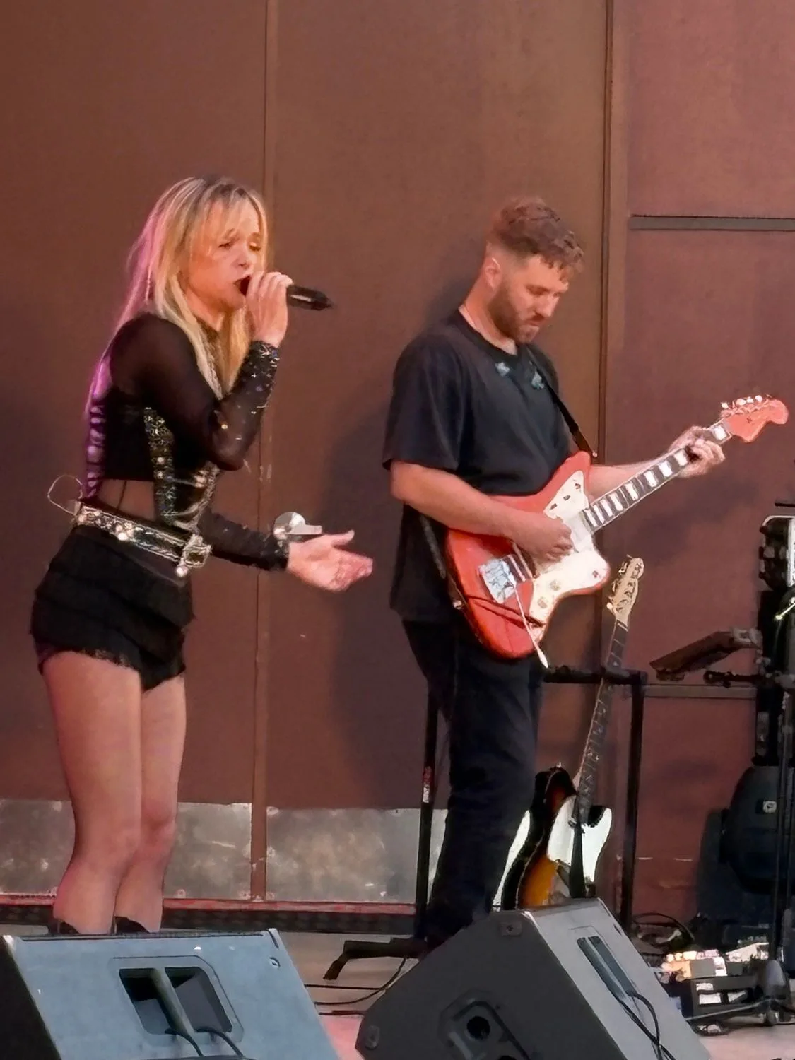 A Country Roads vocalist and electric guitarist performing at Normandale Band Shell