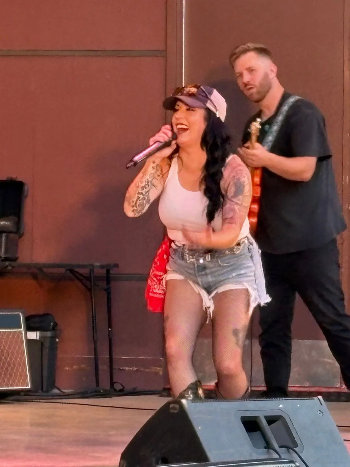 Kat Perkins singing with the Country Roads Band's guitarist at Normandale Band Shell