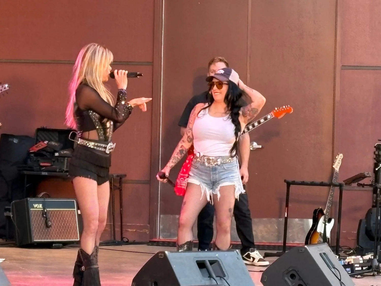 Kat Perkins sharing the stage with another Country Roads vocalist and guitarist in Bloomington